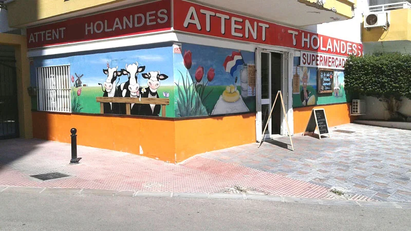 The Attent Holandés corner shop in Fuengirola, with the Dutch cow murals