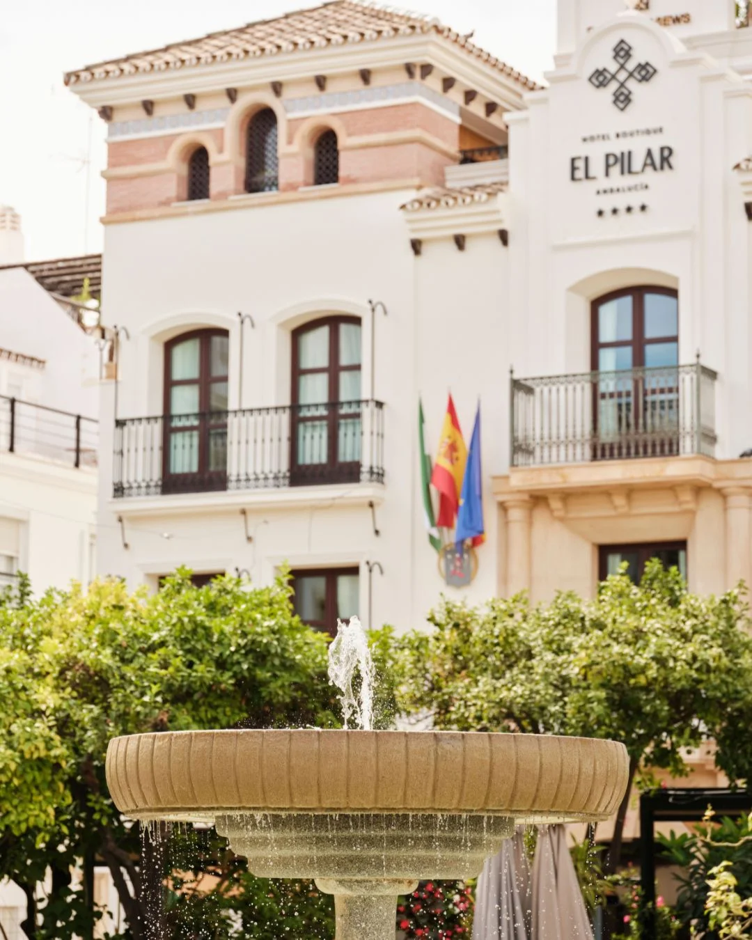 The fountain of Plaza de las Flores in front of Hotel El Pilar Estepona