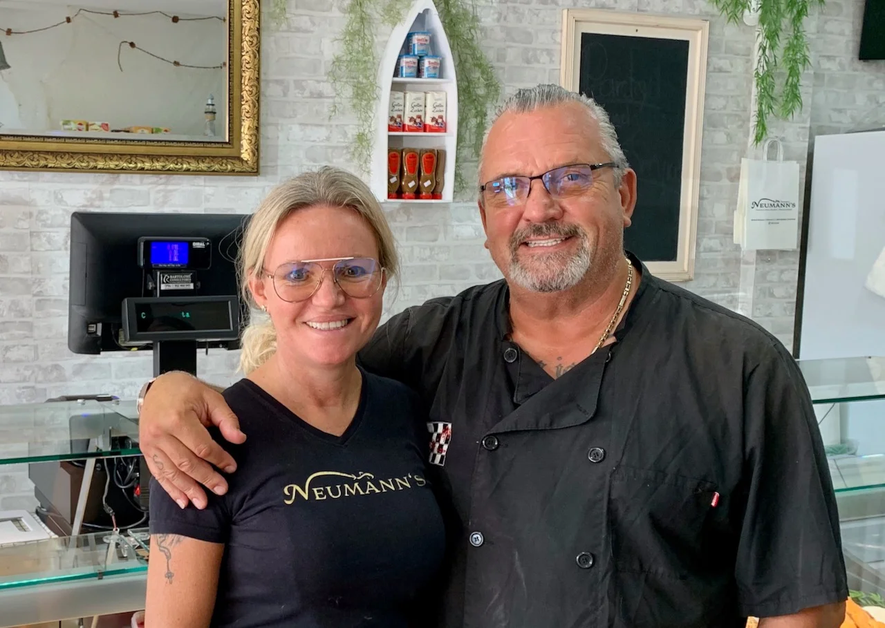 The Neumann's team behind the counter of their German shop in Calahonda