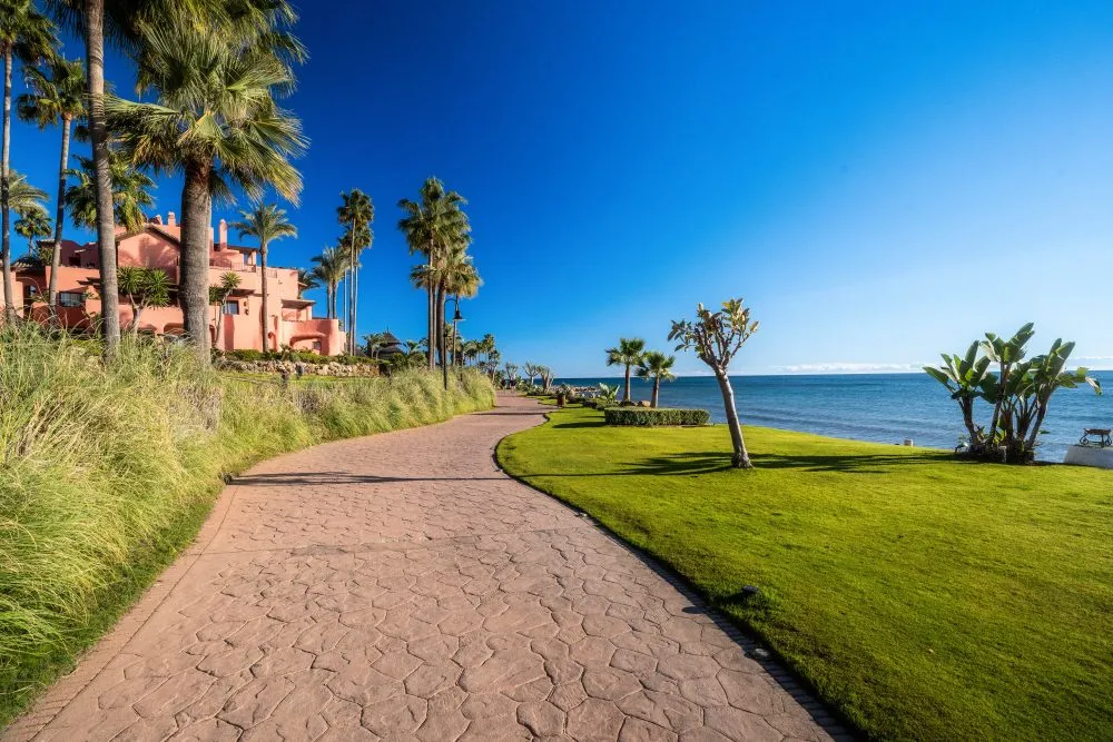 Palm-lined seafront promenade on the New Golden Mile near Estepona