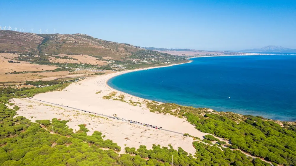 Sweeping sand dunes and turquoise bay at Valdevaqueros beach near Tarifa