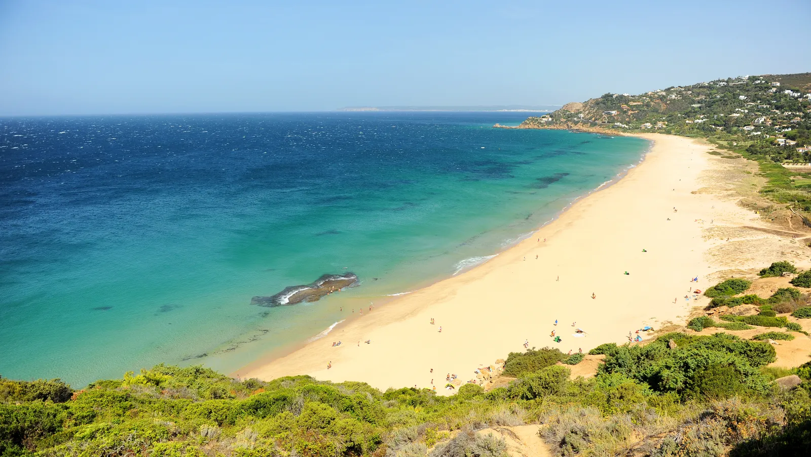 Sweeping sandy beach and turquoise water at Zahara de los Atunes near Tarifa